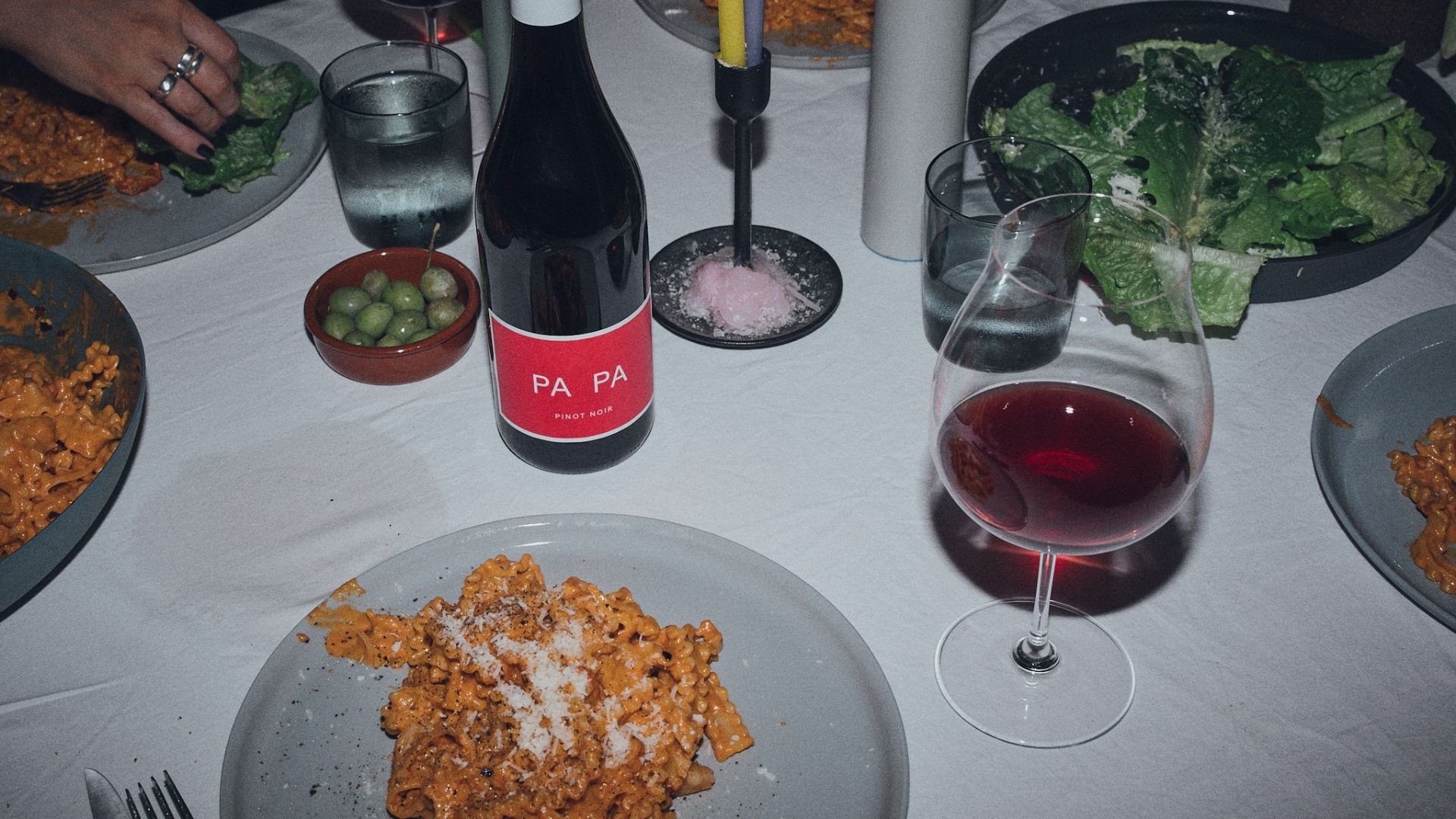 PA PA wine shared around a lively dinner table